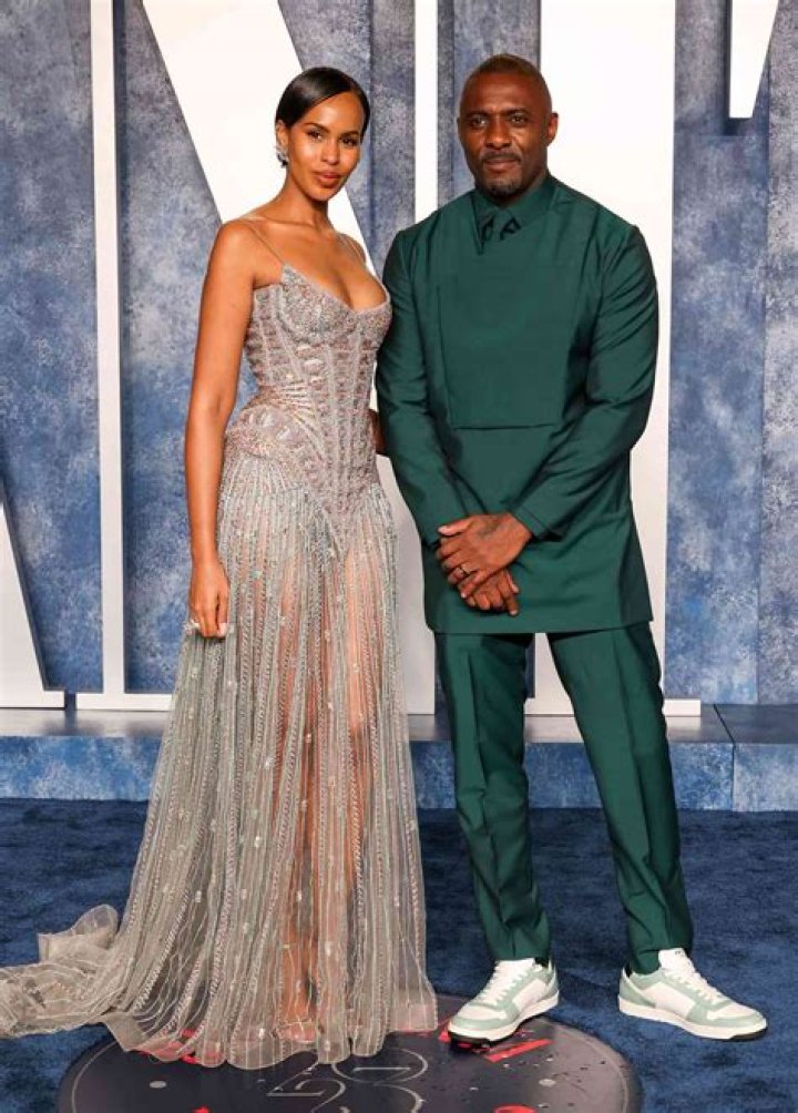 Idris Elba's wife Sabrina has a total Bond-girl moment in silhouette-skimming silky dress